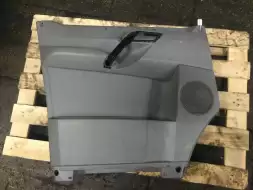 Обшивка двери передней левой (дверная карта)