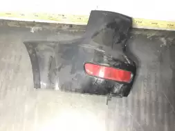 Клык бампера задний левый